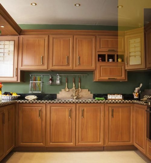Warm wooden kitchen with modern appliances.