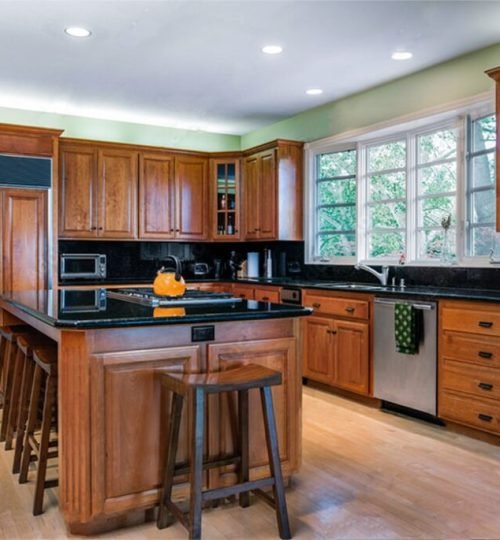 Classic wooden kitchen with island.